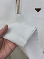 White polo shirt cuff and sleeve hem close-up