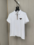 White polo shirt with stand collar, zip placket, and small triangular chest logo