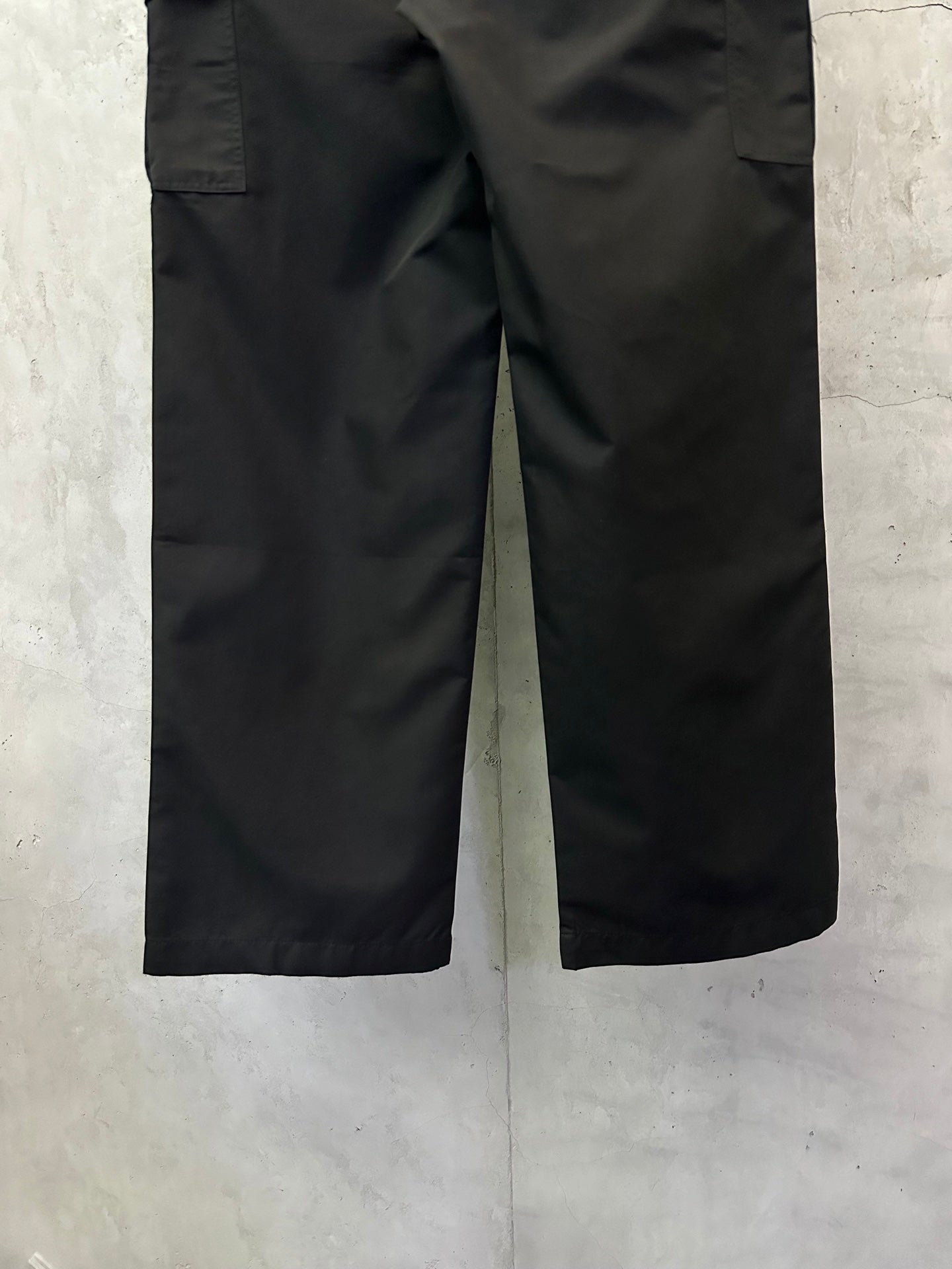Black cargo pants showing leg shape and side cargo pocket