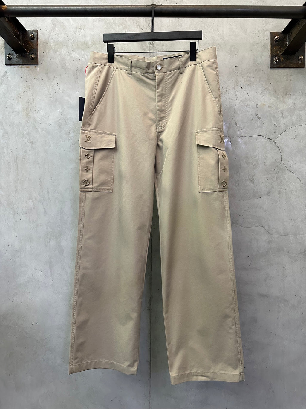 Beige cargo pants with front button and flap cargo pockets