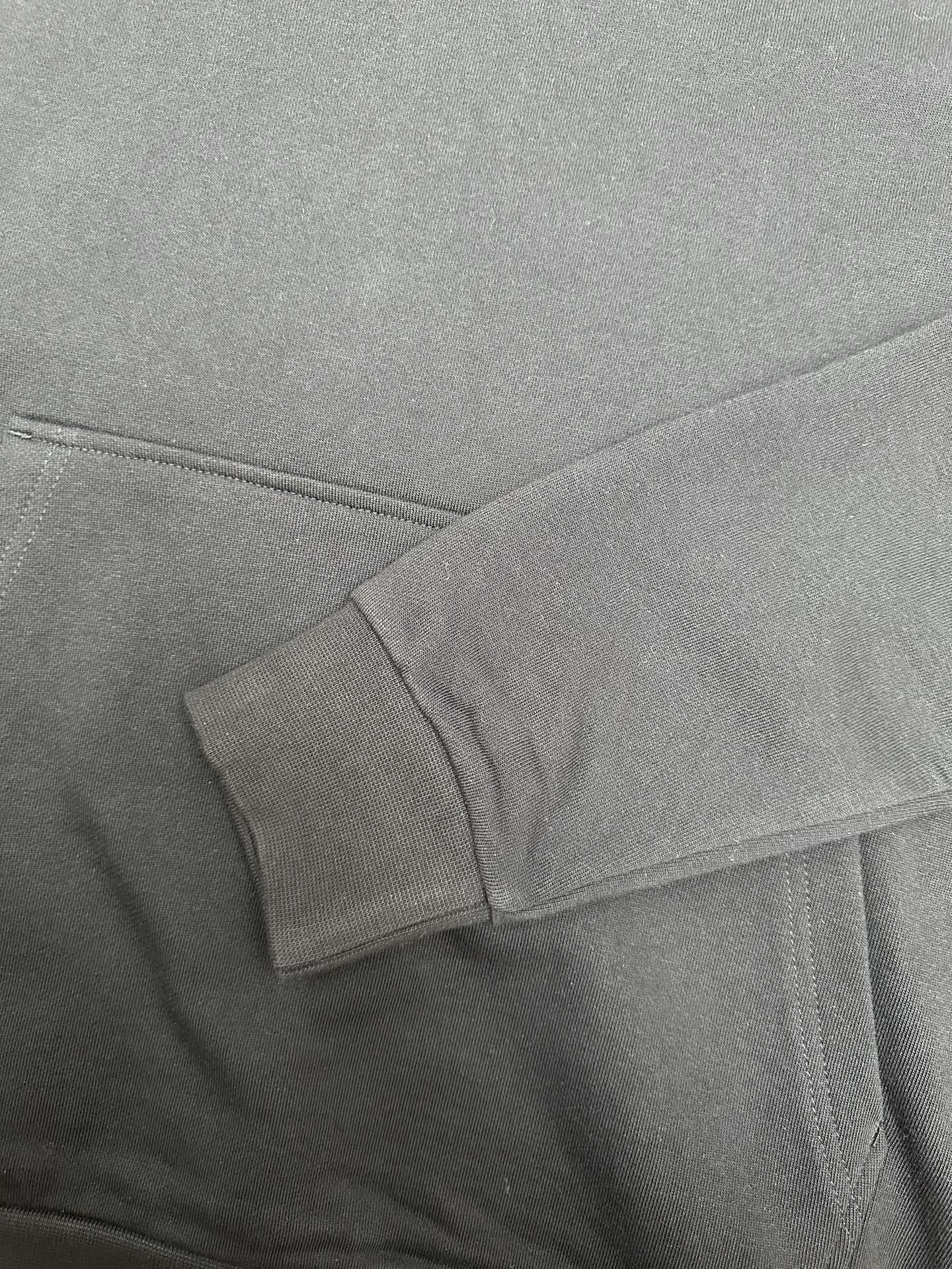 Moncler dark gray hoodie cuff and drawcord near neckline
