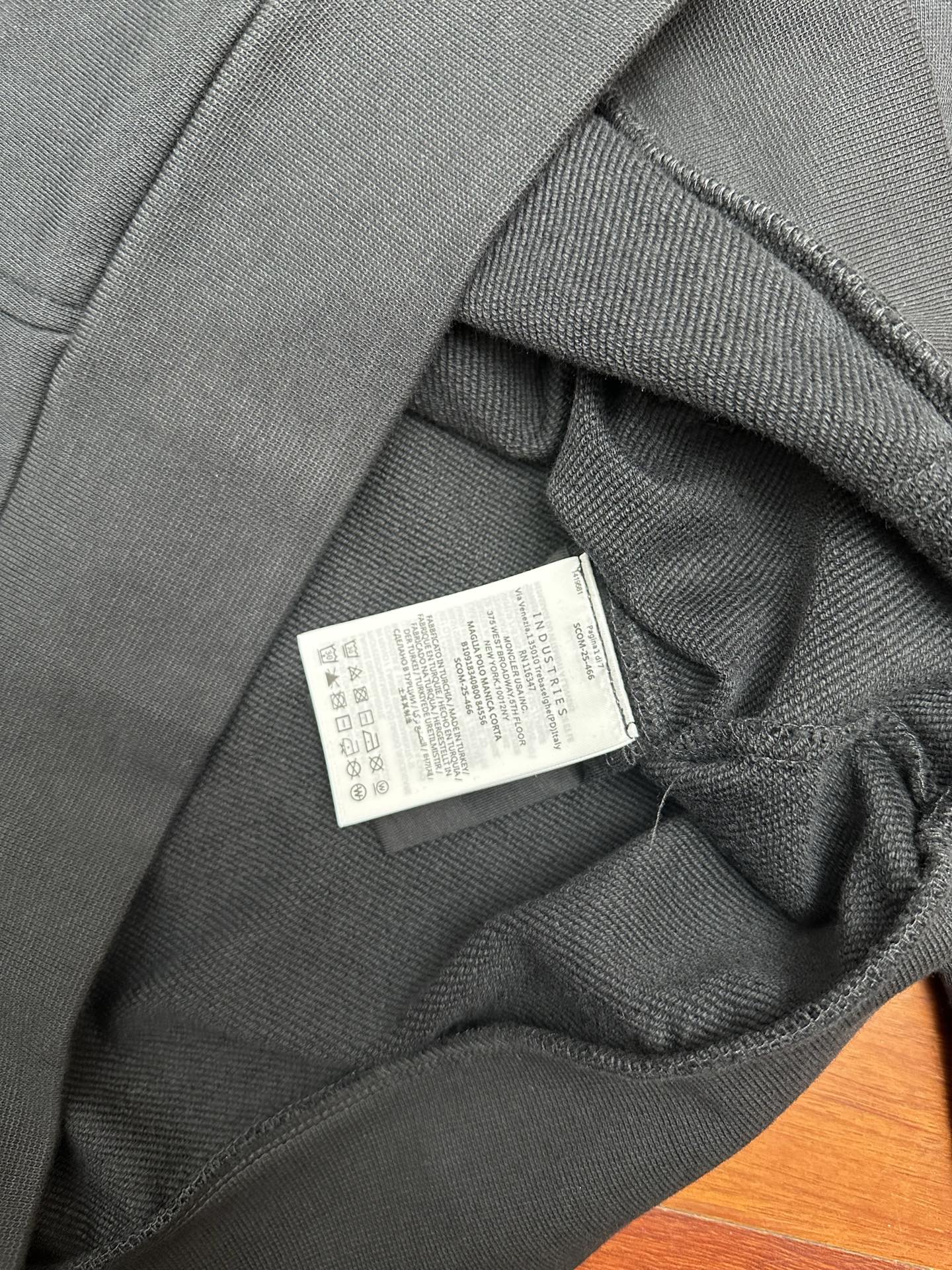 Moncler dark gray hoodie with interior size label near waistband