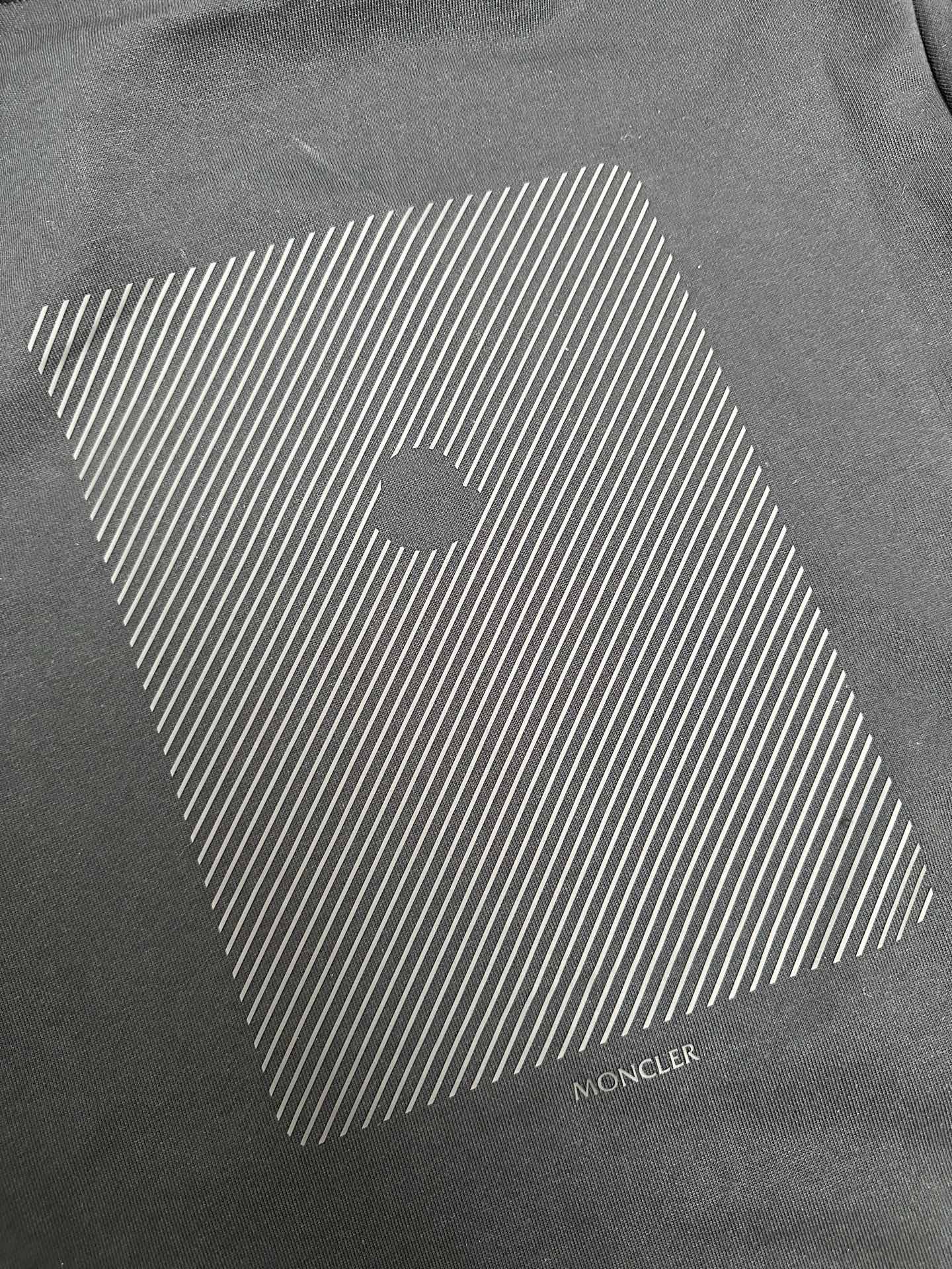 Moncler dark gray hoodie with geometric striped logo print on chest