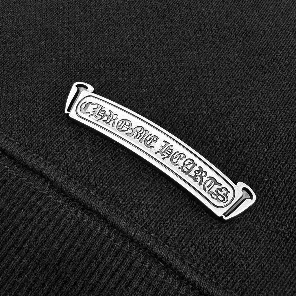 Black sweatshirt neck label with white logo text tag