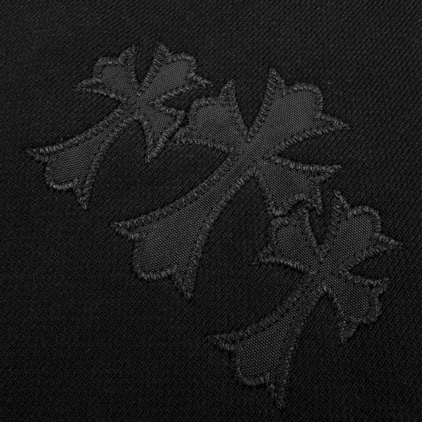 Embroidered black logo graphic on sweatshirt chest
