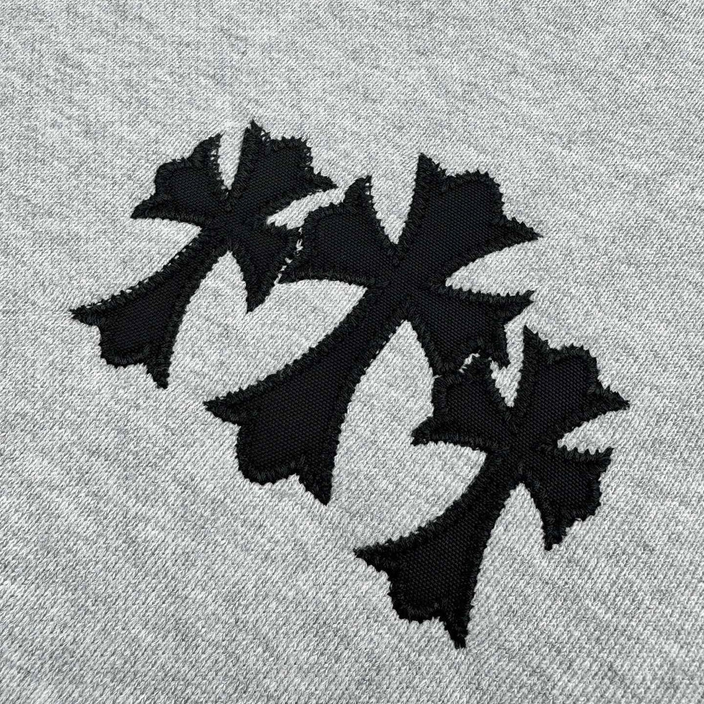 Black applique-style star graphic on heather gray sweatshirt