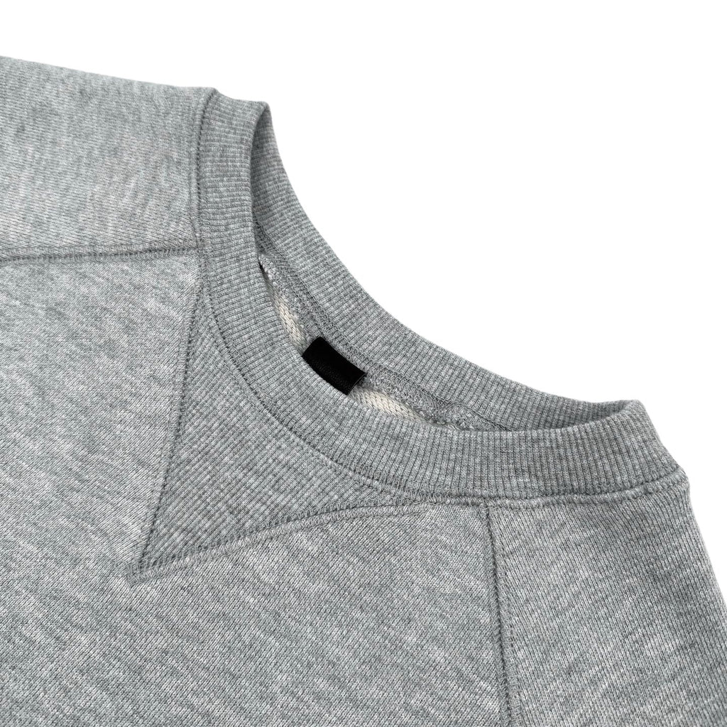 Heather gray crewneck sweatshirt with ribbed collar and raglan seam