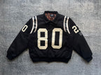 Black varsity jacket with white-striped sleeves and large “80” front patch