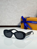 Black round sunglasses with dark lenses and gold LV logo on temple