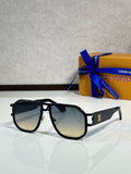 Louis Vuitton sunglasses with black frames and dark tinted lenses, gold detail on arm