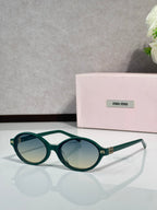 Miu Miu glasses, teal round frames with light green temple tips