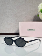 Miu Miu glasses, dark navy round frames with dark lenses