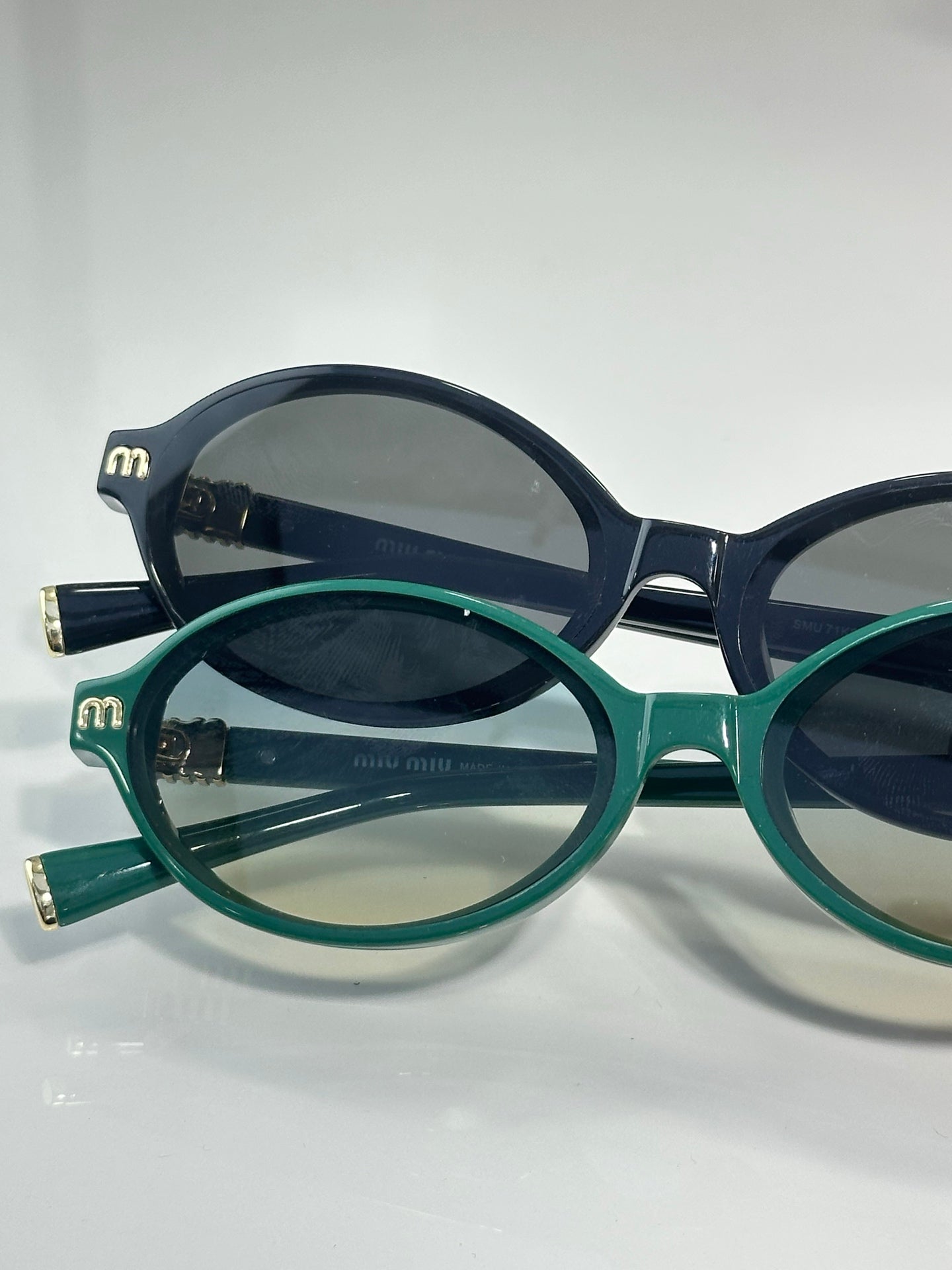 Miu Miu glasses set, teal and navy round frames with dark lenses