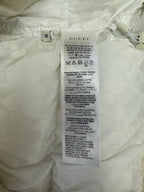 White garment care label with size 38 and fabric instructions