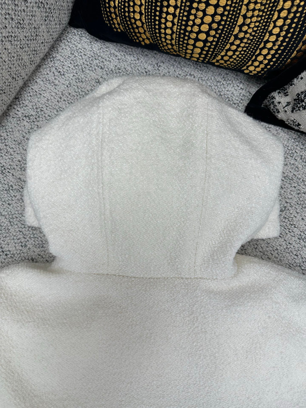 Off-white zip-up hoodie back view with hood