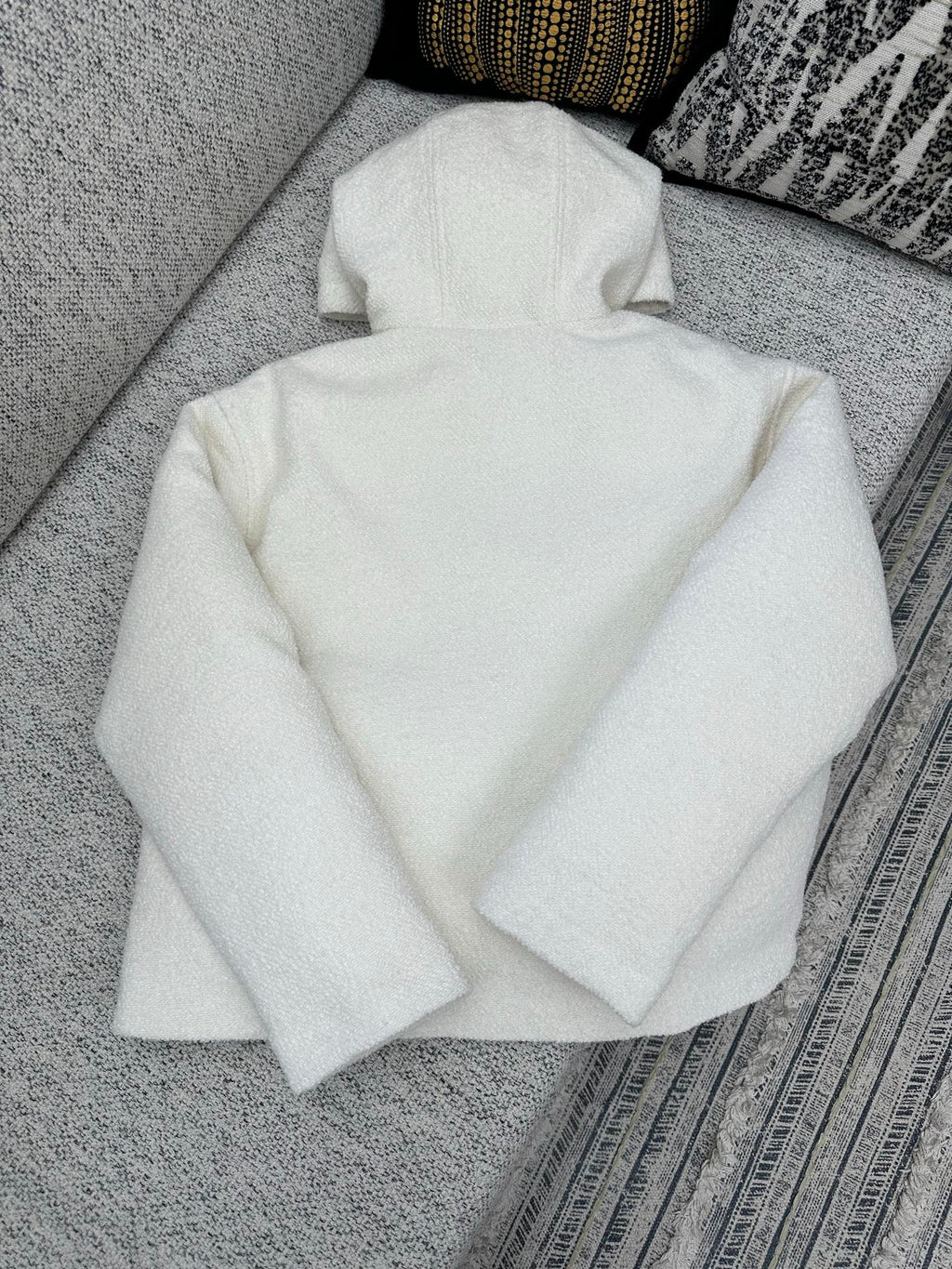 Off-white zip-up hoodie with hood, full zipper front, relaxed fit