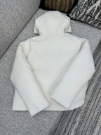 Off-white zip-up hoodie with hood, full zipper front, relaxed fit