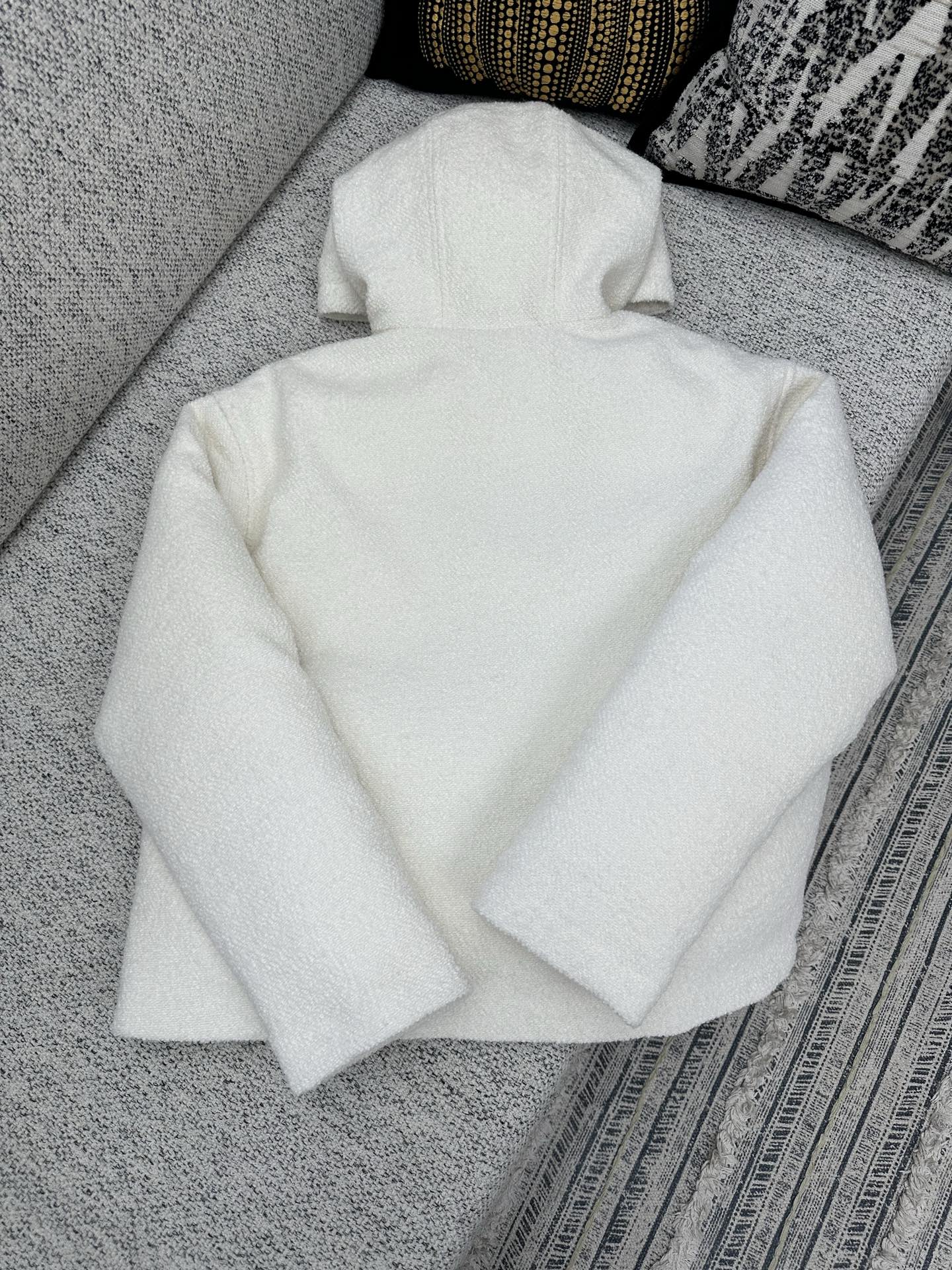 Off-white zip-up hoodie with hood, full zipper front, relaxed fit