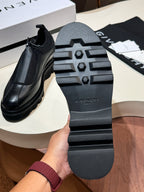 Givenchy black leather loafer sole with tread pattern and brand logo