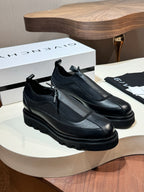 Givenchy black leather loafers with side strap detail and chunky rubber sole
