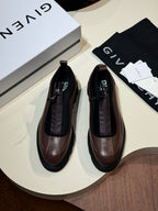 Givenchy lace-up leather shoes, brown and black, with visible laces and rounded toe.