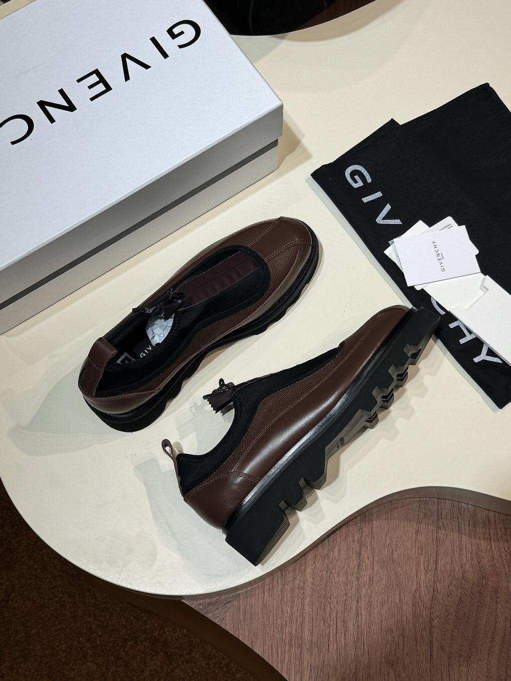 Givenchy lace-up leather shoes, brown leather upper with black sole and side pull tab.