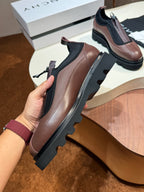 Givenchy lace-up leather shoes, brown leather with black elastic panels and lug sole.