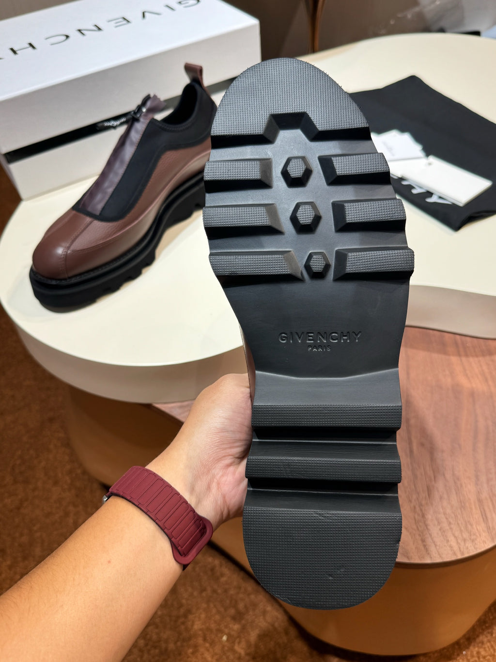 Givenchy lace-up shoes, bottom view: black tread sole with Givenchy logo.