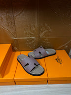 Hermes slide sandals with lilac straps and black rubber sole