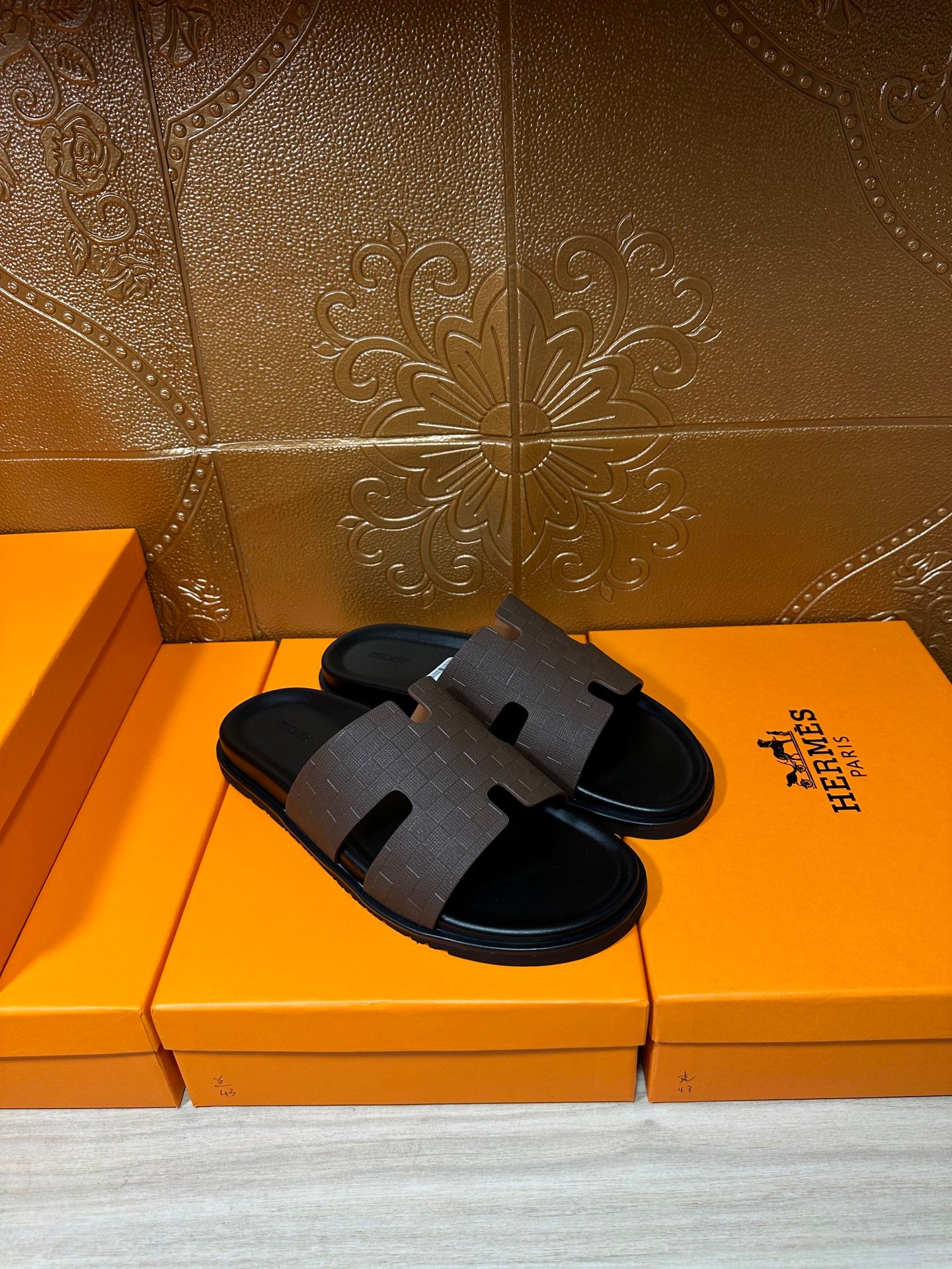 Hermes slide sandals with dark wide strap over cushioned footbed