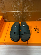 Hermes slide sandals, dark green wide strap and textured footbed, pair on box