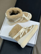 Moncler shearling lace-up boots in light tan with padded collars and rubber lug sole