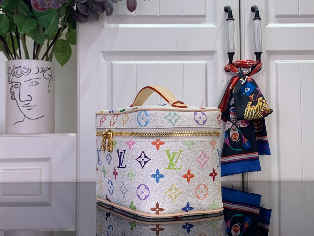 Louis Vuitton vanity bag with multicolor monogram print and tan curved leather handle