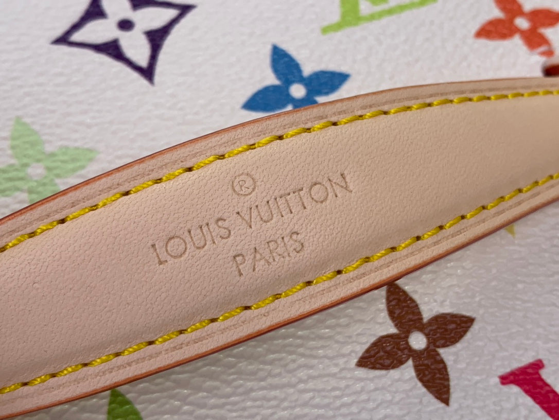 Louis Vuitton leather trim stamped 'Louis Vuitton Paris' on vanity bag