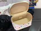 Louis Vuitton vanity bag open with light beige interior and gold zipper trim