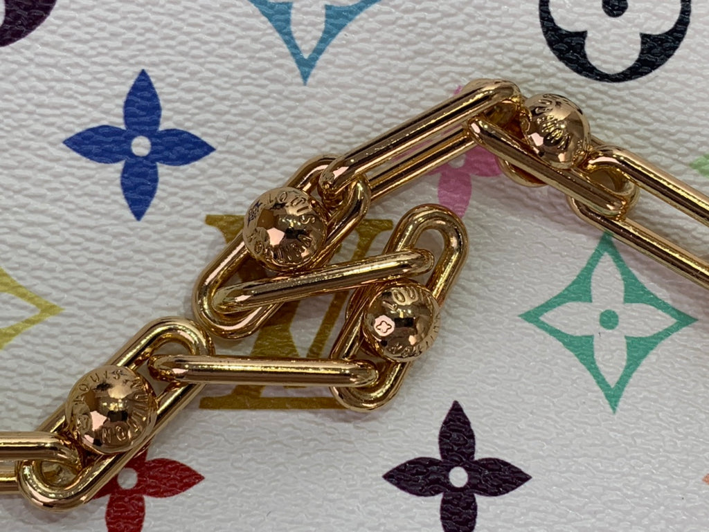 Gold-tone chain hardware on a multicolor monogram crossbody bag