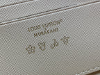 Embossed logo on light beige leather panel of a multicolor monogram crossbody bag