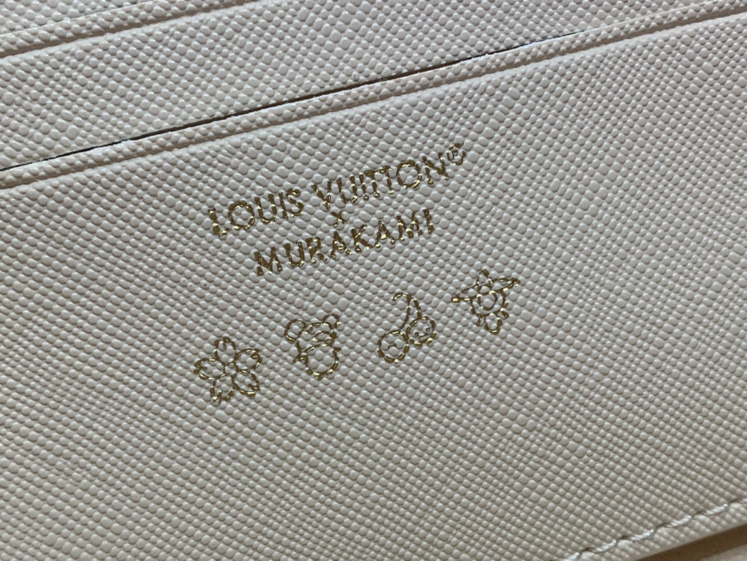 Embossed logo on light beige leather panel of a multicolor monogram crossbody bag