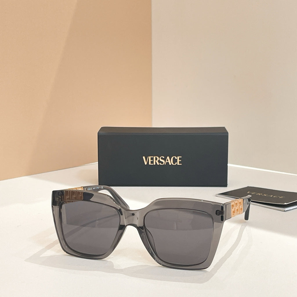 Smoke gray square sunglasses with dark tinted lenses and curved frame