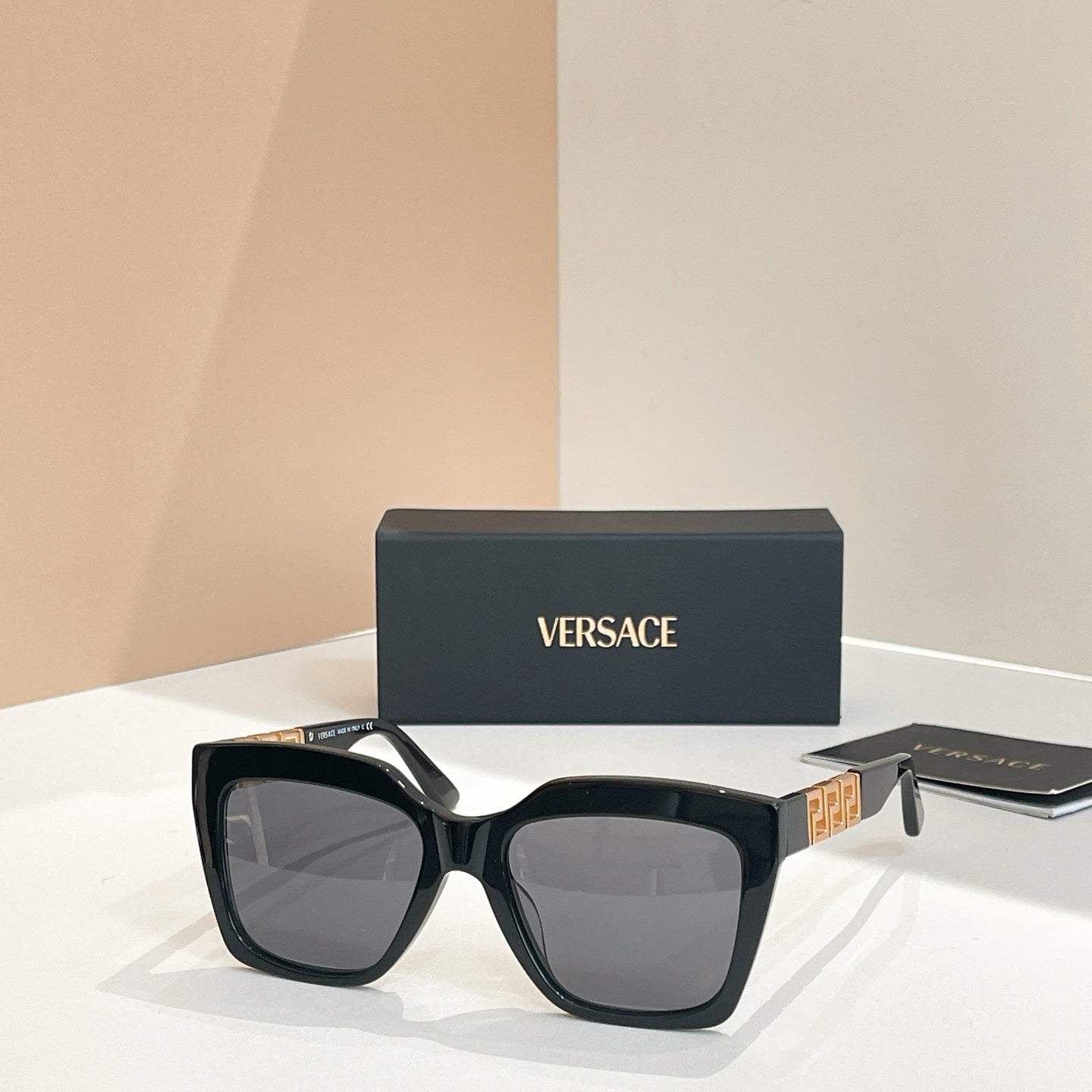 Dark navy square sunglasses with gray tinted lenses and broad temples