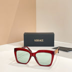 Red square sunglasses with light green lenses and wide frame