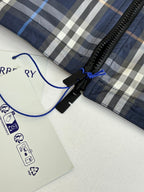 Burberry long jacket with plaid hood lining and black zipper