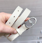 Light leather belt with silver oval buckle and small circular crystal detail