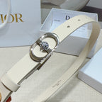 Light leather belt with silver oval buckle and rhinestone center, angled view