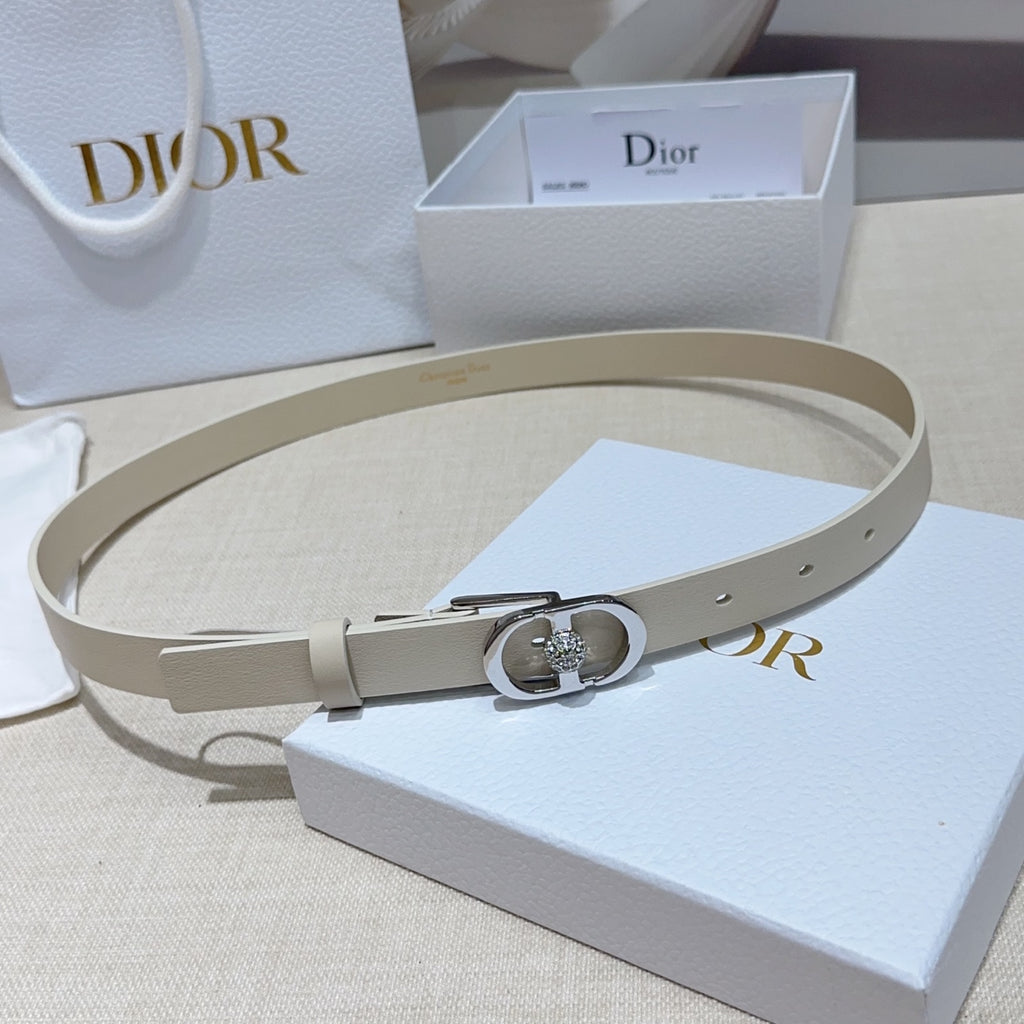 Light leather Dior-style belt with silver oval buckle and rhinestone heart detail