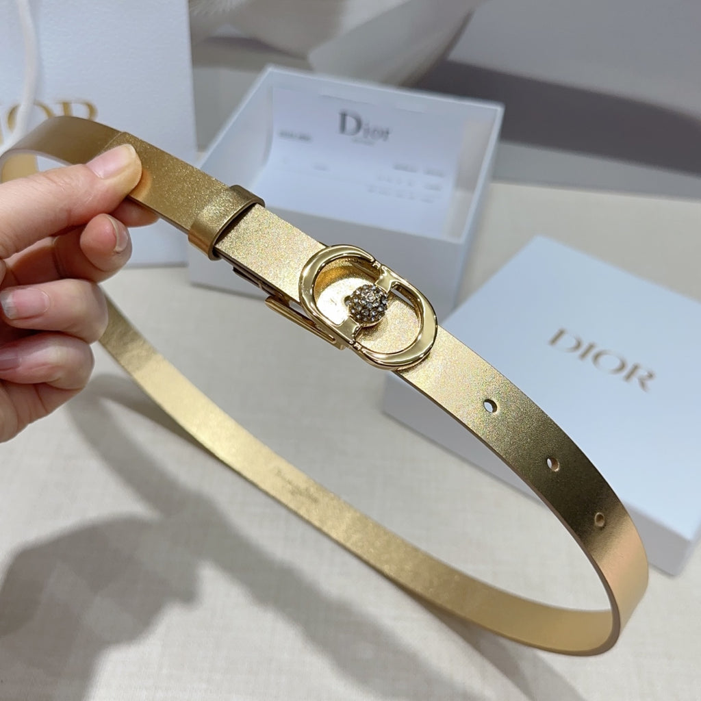 Dior gold-tone belt with single-prong strap buckle and round rhinestone centerpiece