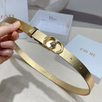 Dior gold-tone belt with single-prong strap buckle and round rhinestone centerpiece