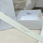 Light gold belt strap with brand text on smooth leather