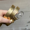 Gold glitter leather belt with oval silver buckle and round crystal detail
