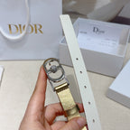 Gold belt with silver oval buckle, crystal center, and adjustable punched strap